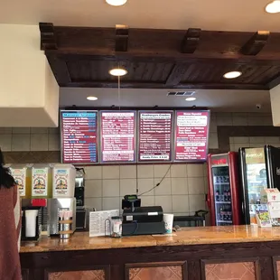 a woman standing at the counter