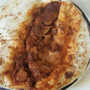 Red chile burrito with beans. Very good. Will be back!