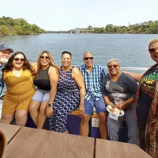 Family at the foot of the boat (and Aaron)