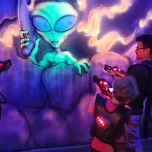 One of the many cool fluorescent artworks in the room.