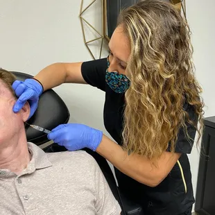 Lisa injecting Sculptra