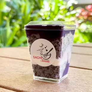 a cup of sachi sweets on a table