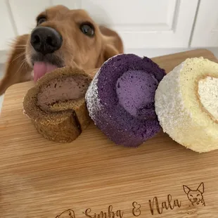 a dog looking over a wooden cutting board