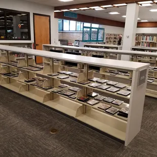 Movies on the shelves, conference room and teen literature/seating area toward the back.
