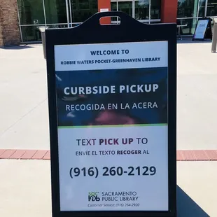 Curbside book pickup sidewalk sign