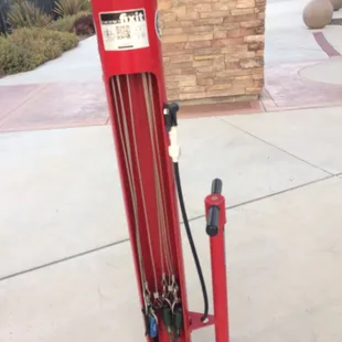 A Dero Fixit bicycle repair station is outside the library