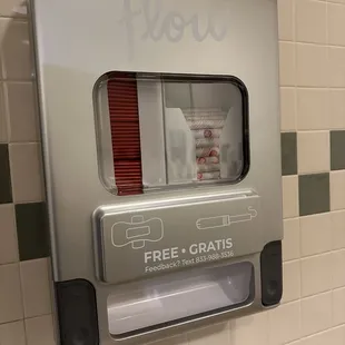 Free sanitary napkins and tampon dispenser.