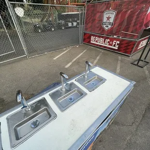 Water stations between beer and merch on the 100s side of the stadium