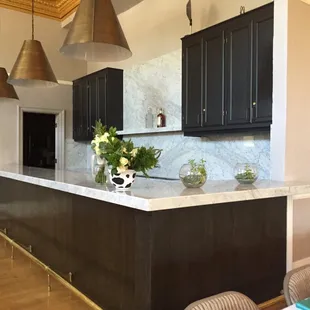 Beautiful marble bar that connects to full kitchen, in the Banquet hall. Took during site visit.