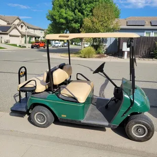Golf cart in street where it was left