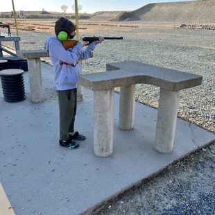 My boy plinking in the .22 range with a daisy bb rifle.