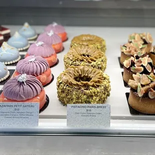 a display of different types of cakes