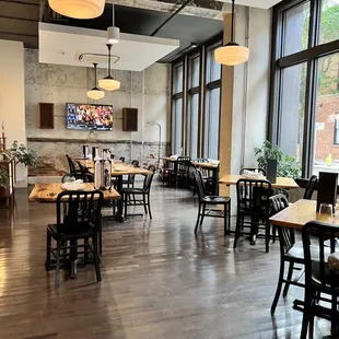 an empty restaurant with tables and chairs