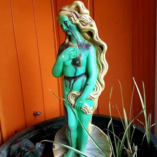 a statue of a woman holding a baby