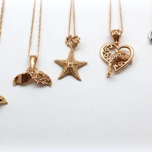 Exclusive Jewels of Mu Hawaiiana pendants in all colors of 18k gold.