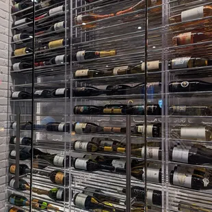 a wine rack full of bottles
