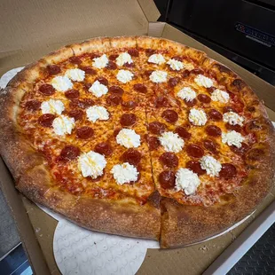 NY style called 18" pizza. It's called PRH. It is red sauce, mozzarella, pepperoni, ricotta florets and Mike's Hot Honey.