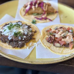 Caveman taco, pulpo taco & pescado taco