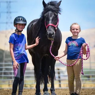 At summer camp the kids learn not only to ride but to lead and care for the horses.