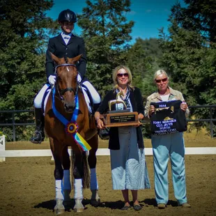 Kodiak and Shayla accepting their trophies