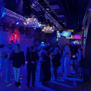 a group of people standing in a room
