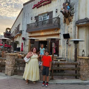 a couple of people standing in front of a building