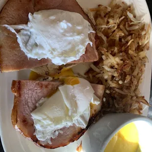 Eggs Benedict with hollandaise on the side.