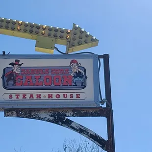 a sign for saddle sore saloon