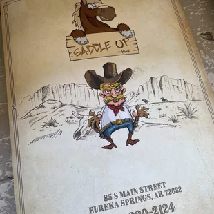 a man in a cowboy hat with a horse in the background