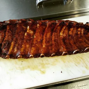 a large piece of meat on a cutting board