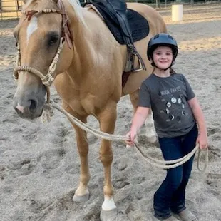 Getting ready for her horse riding lesson with Daisy