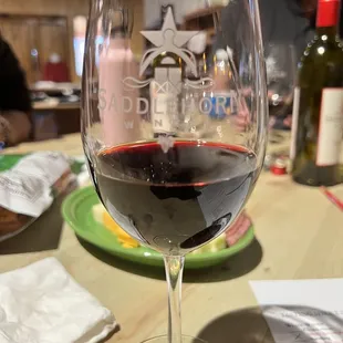 a glass of wine on a table