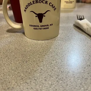 a cup of coffee and a fork