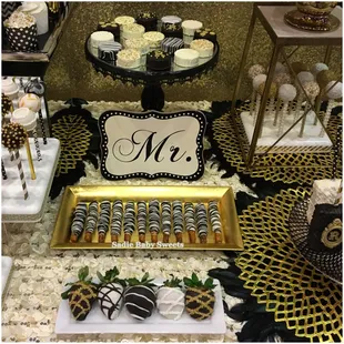 Black, white and gold elegant cake pops, chocolate covered strawberries and Oreo&apos;s, caramel wrapped pretzels