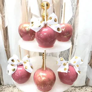 Pretty pink and gold splashed hard candy apples with ribbons