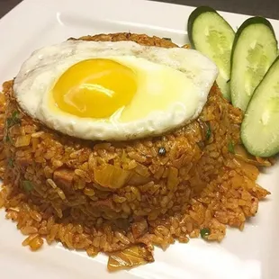 Kimchee Fried Rice - Rice mixed with kimchee, spam, onions, green onions and topped with a fried egg.