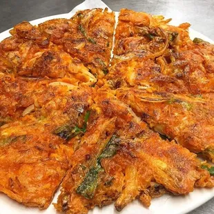 Kimchee Pancake - batter mixed with kimchee, onions and green onions.