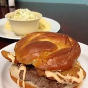 a hamburger with a pretzel bun
