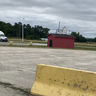 a parking lot with a yellow barrier