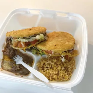 a meal in a styrofoam container
