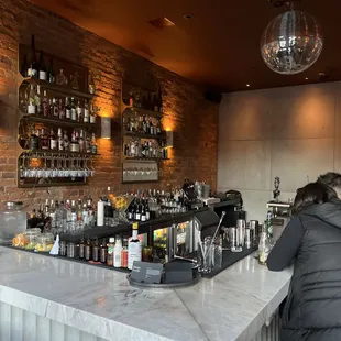 a woman sitting at a bar