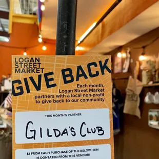 a black magic give back sign