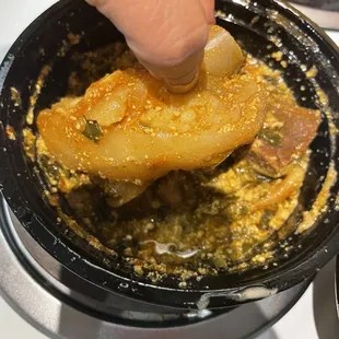 Fufu with Egusi your choice of protein and peanut butter soup