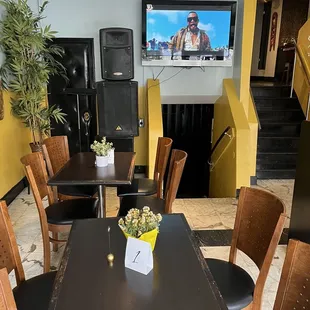 a dining room with a flat screen tv