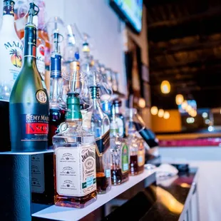 a variety of liquor bottles on a shelf