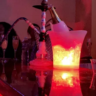 a glass of champagne being poured into an ice bucket