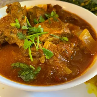 a bowl of stew with meat and vegetables