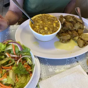 Veggie entree with green banana and salad