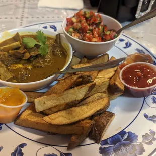 Goat curry, fries, kachumbari, habanero sauce