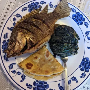 Samaki (Fried Tilapia) with sides of terere (amaranth greens) and chapati bread